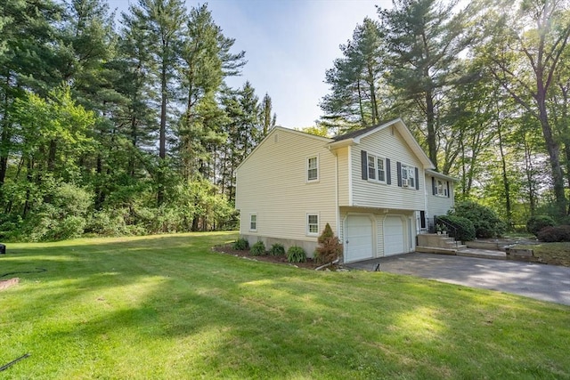 143 Davis St, Northborough, MA 01532 - view of side of property featuring driveway, a garage, and a lawn