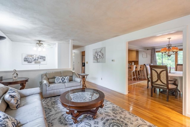 143 Davis St, Northborough, MA 01532 - living room with light wood-type flooring, ceiling fan, and baseboards