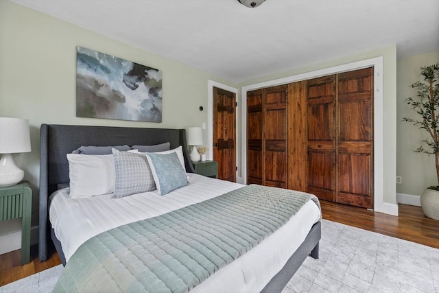 213 Thurston St, Wrentham, MA 02093 - bedroom featuring a closet, wood finished floors, and baseboards