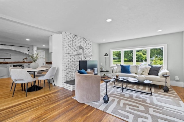 213 Thurston St, Wrentham, MA 02093 - living area featuring wood finished floors, recessed lighting, and baseboards