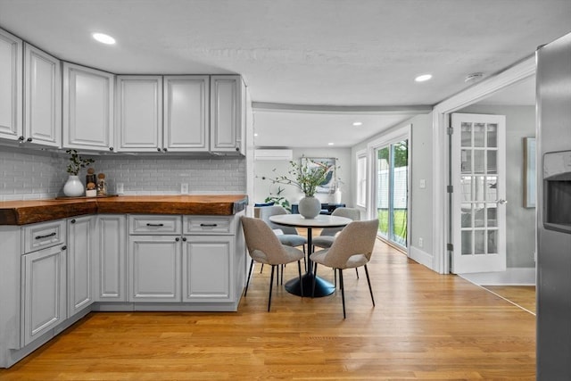 213 Thurston St, Wrentham, MA 02093 - kitchen featuring a wall mounted AC, light wood-style flooring, tasteful backsplash, baseboards, and recessed lighting