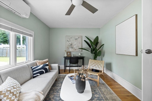 213 Thurston St, Wrentham, MA 02093 - living area with an AC wall unit, ceiling fan, wood finished floors, and baseboards