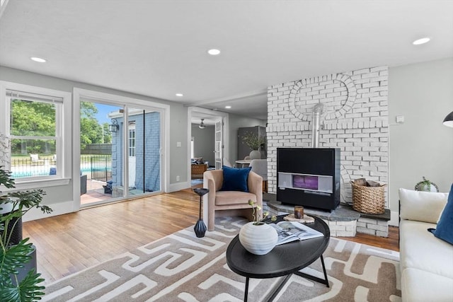 213 Thurston St, Wrentham, MA 02093 - living room featuring wood finished floors, a fireplace, recessed lighting, and baseboards