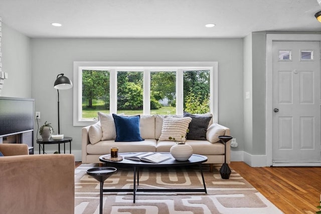 213 Thurston St, Wrentham, MA 02093 - living area with plenty of natural light, wood finished floors, and recessed lighting
