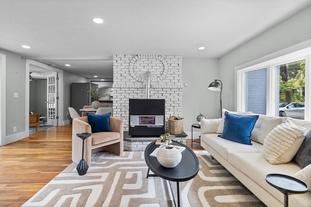 213 Thurston St, Wrentham, MA 02093 - living room featuring wood finished floors, recessed lighting, a fireplace, and baseboards
