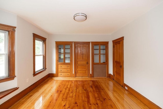 spare room with light wood-type flooring