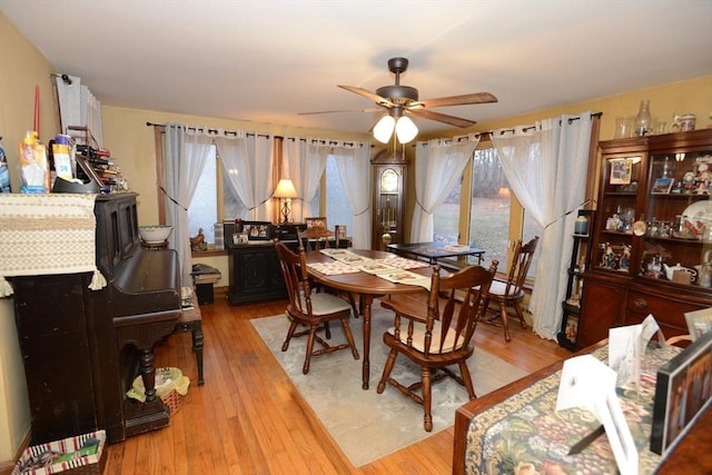 dining area featuring hardwood / wood-style flooring and ceiling fan