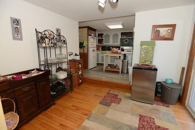 interior space featuring built in shelves and light hardwood / wood-style flooring