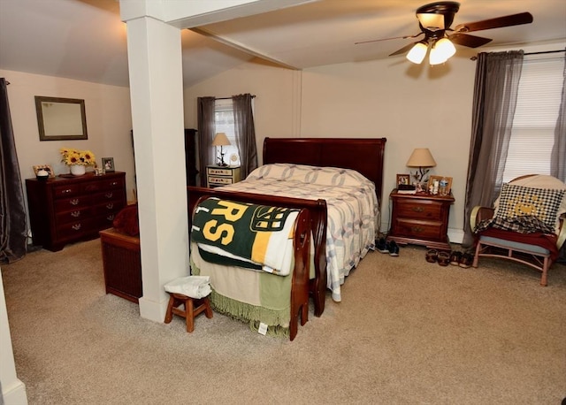 bedroom featuring ceiling fan, light colored carpet, and vaulted ceiling