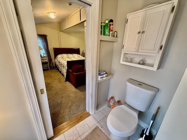 bathroom featuring tile patterned flooring and toilet