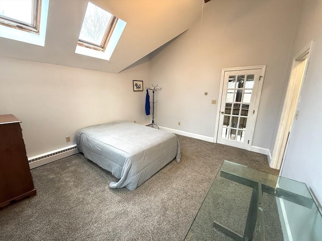 bedroom featuring vaulted ceiling with skylight, dark colored carpet, and a baseboard heating unit