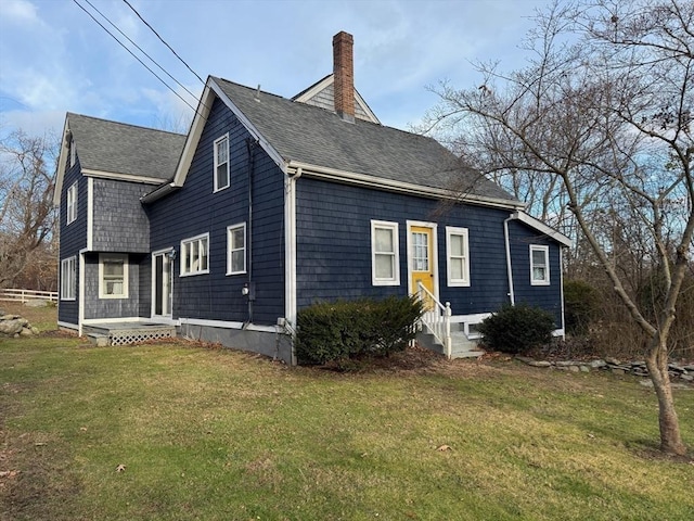 view of front of home with a front lawn