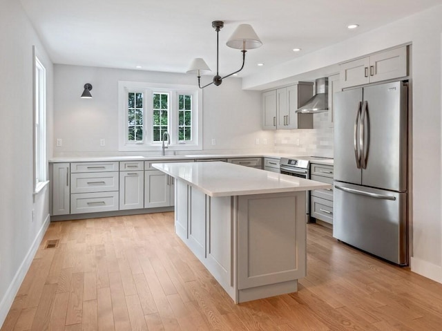 128 Old Southbridge Rd, Dudley, MA 01571 - kitchen with freestanding refrigerator, wall chimney range hood, gray cabinets, and recessed lighting