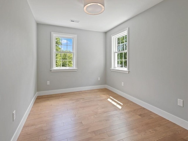 128 Old Southbridge Rd, Dudley, MA 01571 - empty room with plenty of natural light and light wood finished floors