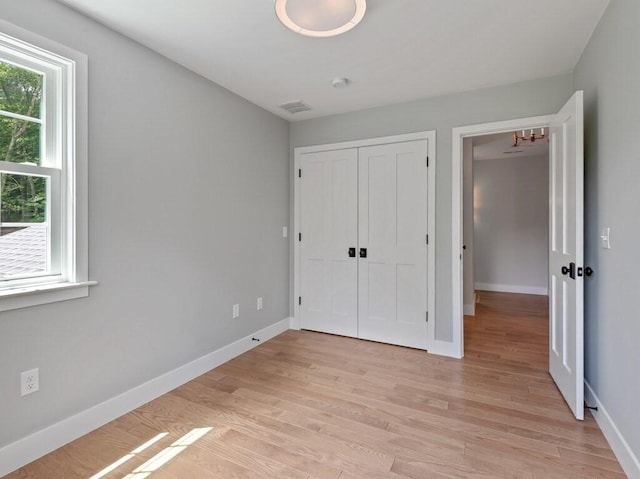 128 Old Southbridge Rd, Dudley, MA 01571 - unfurnished bedroom featuring light wood finished floors and a closet