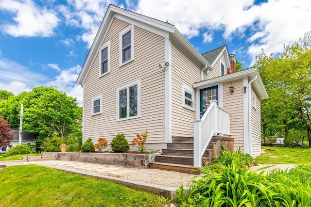 38 Davis St, Plymouth, MA 02360 - view of front of home featuring a chimney and a front lawn