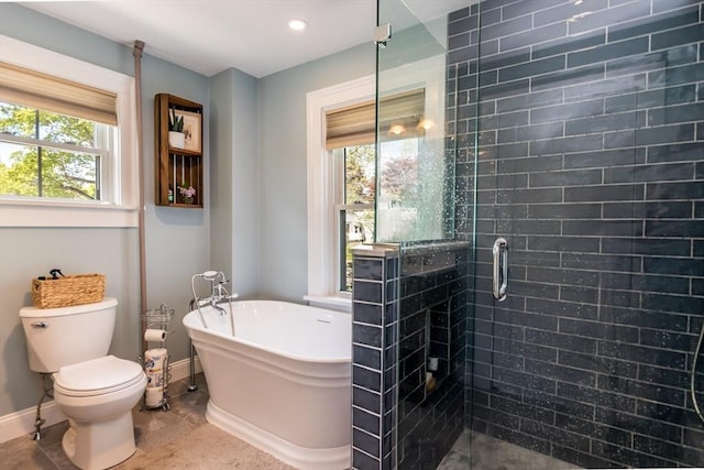 38 Davis St, Plymouth, MA 02360 - full bathroom featuring baseboards, a shower stall, a freestanding bath, toilet, and recessed lighting