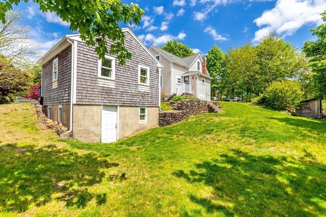 38 Davis St, Plymouth, MA 02360 - view of side of property with a yard