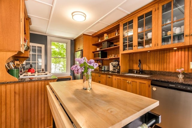 38 Davis St, Plymouth, MA 02360 - kitchen with appliances with stainless steel finishes, a sink, butcher block counters, open shelves, and brown cabinets