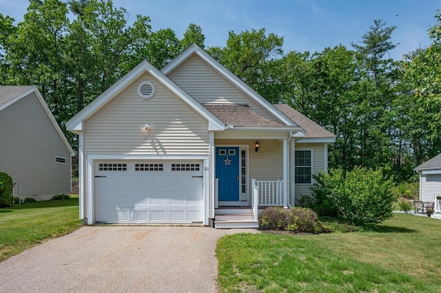 21 Cielo Dr, Dover, NH 03820 - view of front of house featuring asphalt driveway, an attached garage, a front yard, and roof with shingles