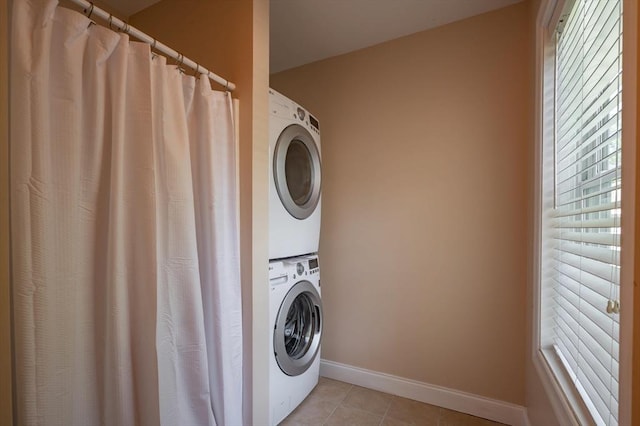 21 Cielo Dr, Dover, NH 03820 - laundry room with stacked washer / dryer and light tile patterned floors