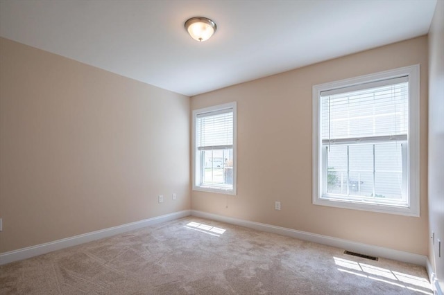 21 Cielo Dr, Dover, NH 03820 - spare room featuring baseboards and carpet