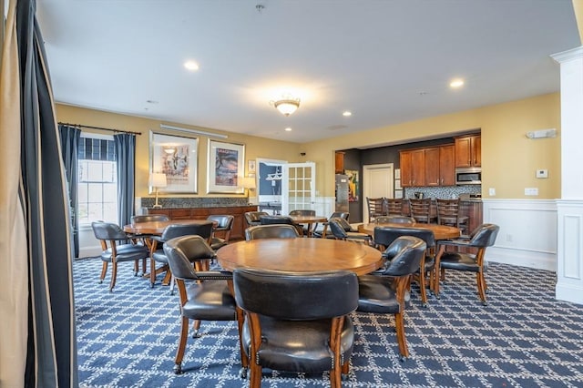 21 Cielo Dr, Dover, NH 03820 - dining space with dark carpet, a wainscoted wall, a decorative wall, and recessed lighting