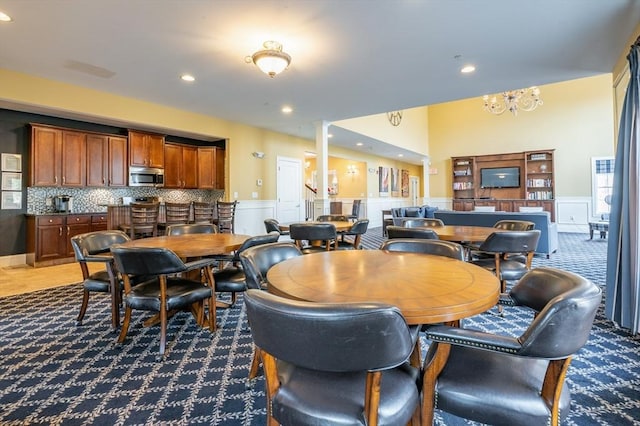 21 Cielo Dr, Dover, NH 03820 - carpeted dining space featuring a wainscoted wall, recessed lighting, a decorative wall, a chandelier, and decorative columns