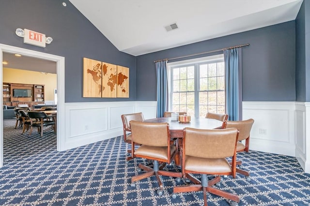 21 Cielo Dr, Dover, NH 03820 - dining space featuring carpet, a wainscoted wall, vaulted ceiling, and a decorative wall