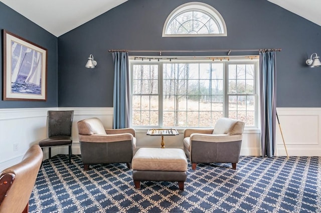 21 Cielo Dr, Dover, NH 03820 - living area with lofted ceiling, carpet flooring, a wainscoted wall, and a decorative wall
