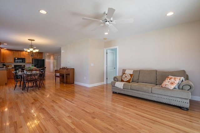 21 Cielo Dr, Dover, NH 03820 - living area with a chandelier, light wood finished floors, ceiling fan, and recessed lighting
