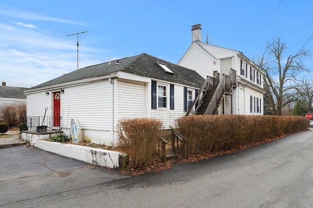 view of side of property with a chimney