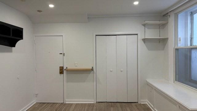mudroom with wood finished floors, baseboards, and recessed lighting