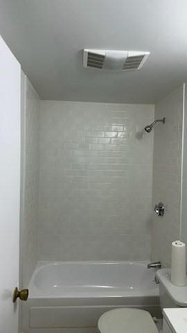 full bath featuring visible vents, shower / tub combination, and toilet