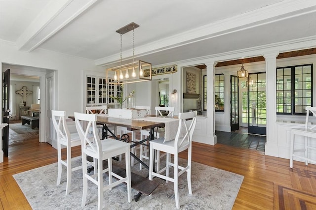 4 Porter St, Granby, MA 01033 - dining space with ornamental molding, wood finished floors, ornate columns, and beam ceiling