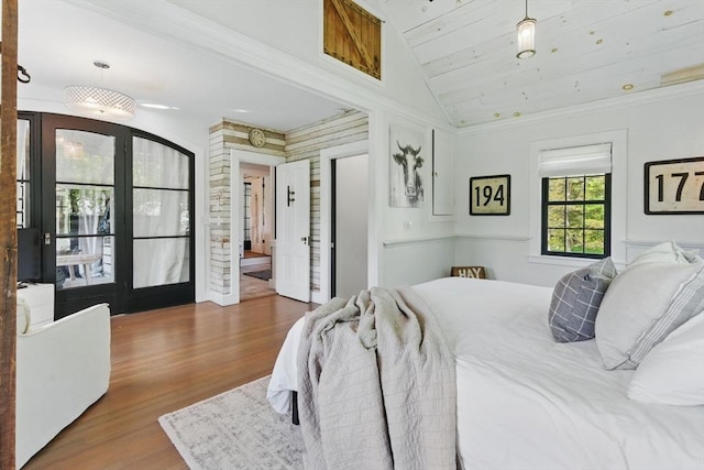 4 Porter St, Granby, MA 01033 - bedroom featuring vaulted ceiling, wood finished floors, ornamental molding, and french doors