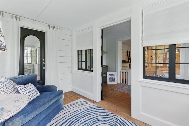 4 Porter St, Granby, MA 01033 - living area with wood finished floors and arched walkways