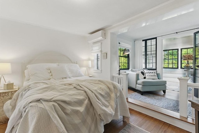 4 Porter St, Granby, MA 01033 - bedroom with an AC wall unit and hardwood / wood-style flooring