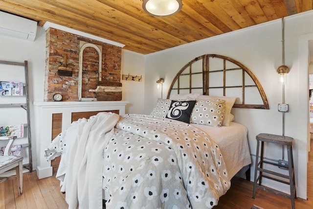 4 Porter St, Granby, MA 01033 - bedroom featuring a wall unit AC, wooden ceiling, and wood-type flooring