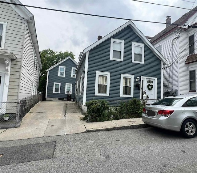 31 Abbott St, Lowell, MA 01852 - view of front facade featuring a chimney