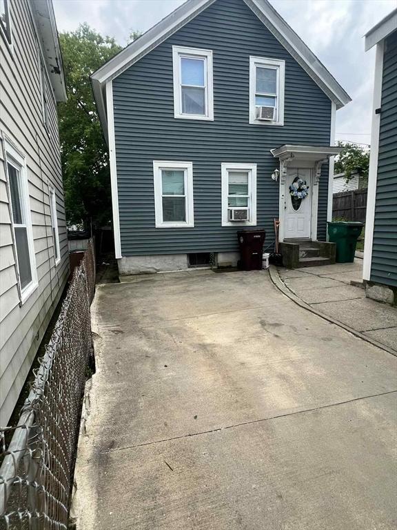 31 Abbott St, Lowell, MA 01852 - rear view of house with a patio and cooling unit