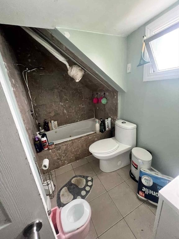 31 Abbott St, Lowell, MA 01852 - bathroom featuring toilet and tile patterned floors
