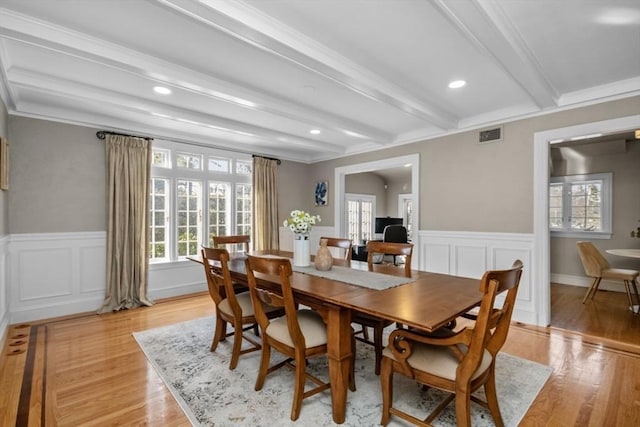 dining space featuring recessed lighting, visible vents, light wood-style floors, ornamental molding, and beamed ceiling