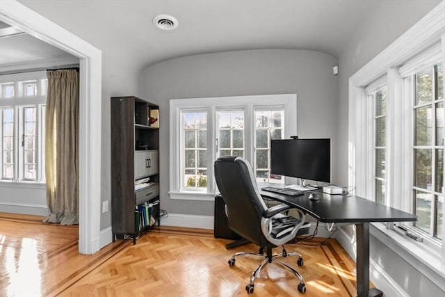 office featuring baseboards and visible vents