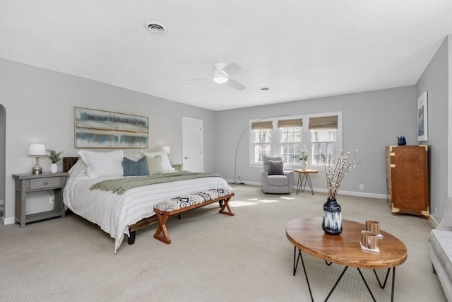 bedroom featuring a ceiling fan, carpet flooring, visible vents, and baseboards