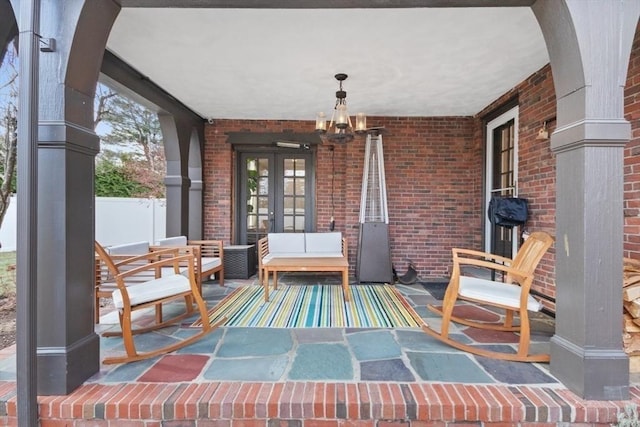 view of patio / terrace featuring covered porch and french doors