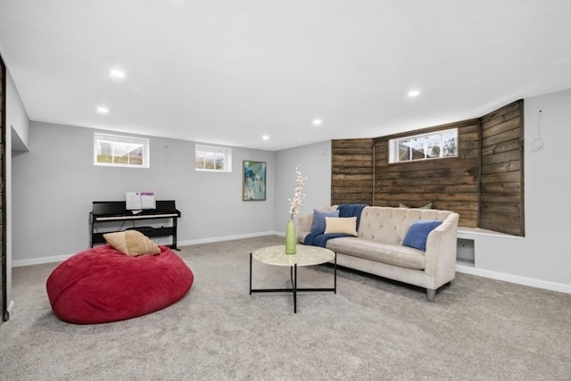 living room featuring baseboards, recessed lighting, and light colored carpet