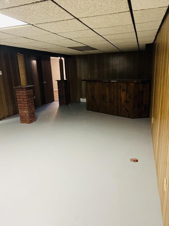 209 Casey Dr, Chicopee, MA 01020 - finished basement with wood walls and a dry bar