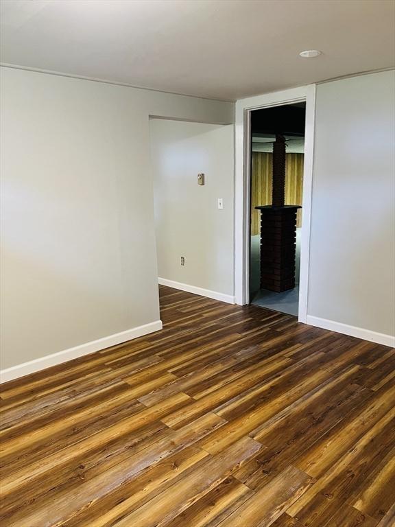 209 Casey Dr, Chicopee, MA 01020 - empty room featuring dark wood-type flooring and baseboards