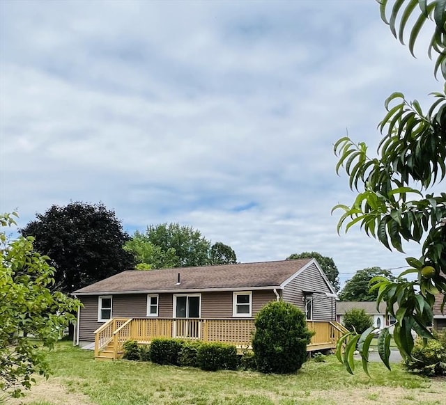 209 Casey Dr, Chicopee, MA 01020 - view of front of property featuring a deck and a front lawn
